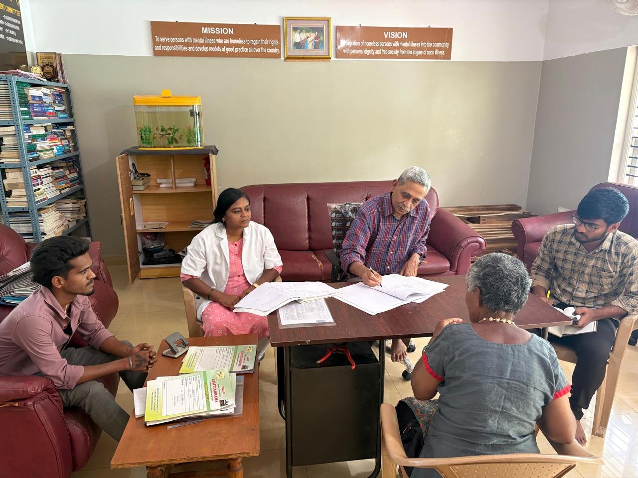 Doctors reviewing a resident's case file
